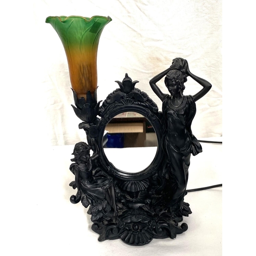 1 - A bronzed table lamp decorated with girls, with coloured shade and mirror back
