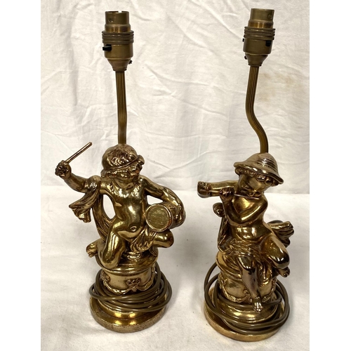22B - A pair of composition classical style gilt table lamps, cherubs playing instruments
