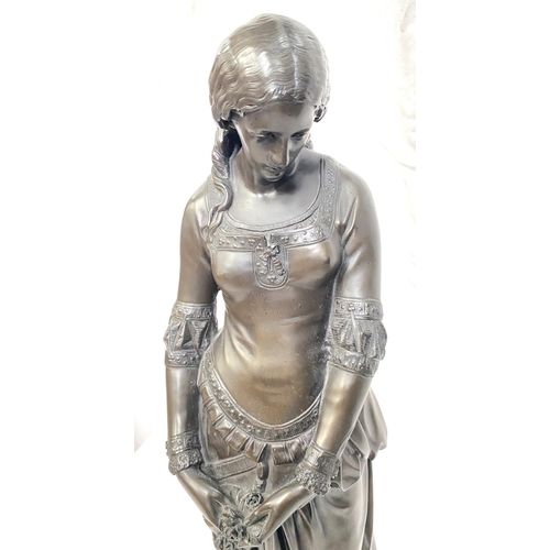 4 - A large bronzed resin figure of a young woman with purse, height 57cm