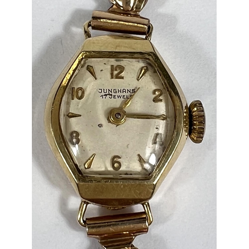 A JUNGHANS lady s watch with 14 ct case cream dial gold hands