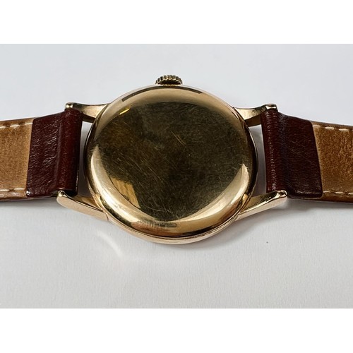 688B - IWC (International Watch Company): a 1950's oversized 9ct gold cased gents wrist watch with Arabic N... 