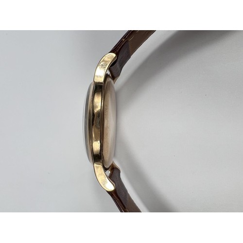 688B - IWC (International Watch Company): a 1950's oversized 9ct gold cased gents wrist watch with Arabic N... 