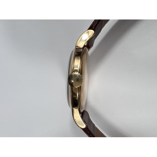 688B - IWC (International Watch Company): a 1950's oversized 9ct gold cased gents wrist watch with Arabic N... 