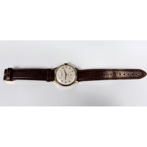 688B - IWC (International Watch Company): a 1950's oversized 9ct gold cased gents wrist watch with Arabic N... 