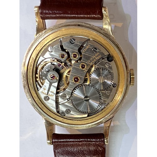 688B - IWC (International Watch Company): a 1950's oversized 9ct gold cased gents wrist watch with Arabic N... 
