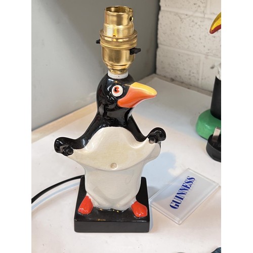 551 - A Carlton ware Guinness penguin lamp, another similar Toucan Carlton ware style lamp, etc