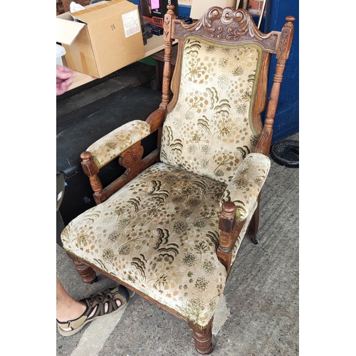 865 - An Edwardian walnut armchair in floral upholstery