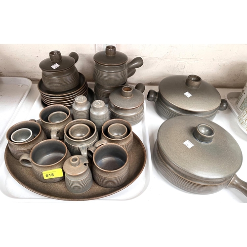 556 - A large selection of Denby dinner and tea ware including plates, soup dishes etc