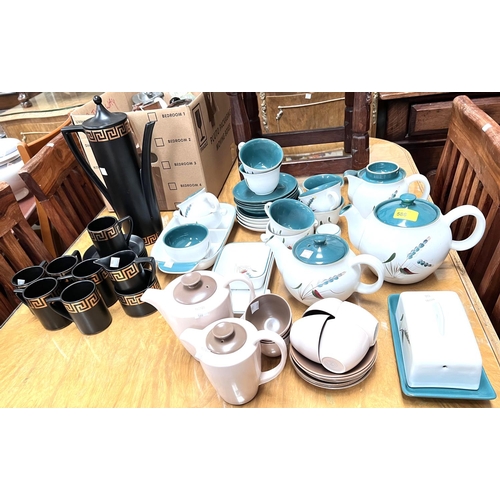 557 - A Denby Greenwheat part tea set; a 1950's Poole part coffee set; a Portmeirion 15 piece coffee set, ... 