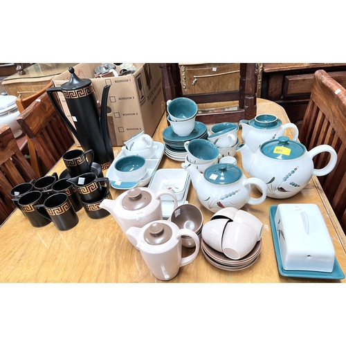 557 - A Denby Greenwheat part tea set; a 1950's Poole part coffee set; a Portmeirion 15 piece coffee set, ... 