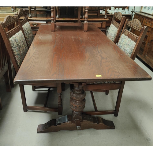 853 - A good quality oak refectory carved pineapple supported dining table, 138x92cm and a set of 6 (4+2) ... 