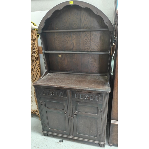 831 - An oak reproduction Dutch dresser with 3 shelves, 2 height and double cupboard/drawers, width 94cm