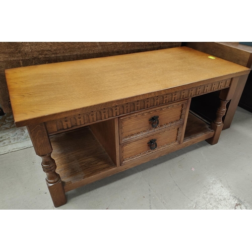 860 - A Jacobean style oak 2 tier occasional table with central drawers