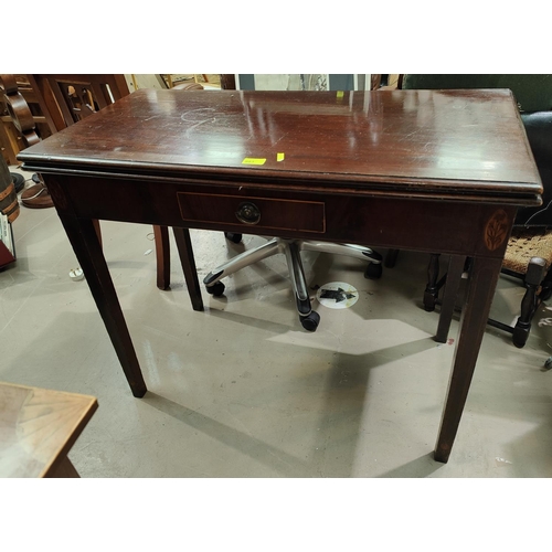 814 - An early 19th century mahogany fold over card table