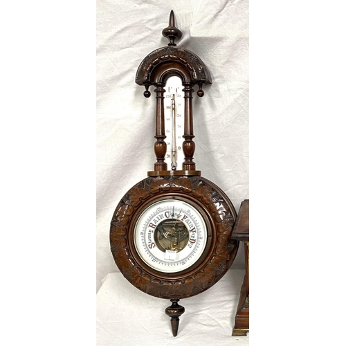 1 - An Edwardian aneroid barometer and thermometer in carved walnut case; an Edwardian striking mantel c... 