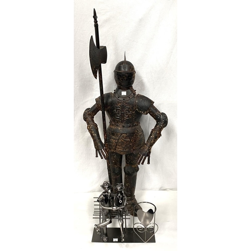 106 - A period style knight in armour, height 90cm; a wrought metal ornament:  seated couple