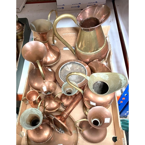 107 - A selection of copper and brass jugs and vases
