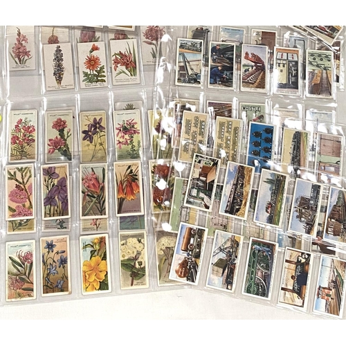 124 - A selection of cigarette cards:  South African wildflowers, 25; Australia  wildflower 50; ... 