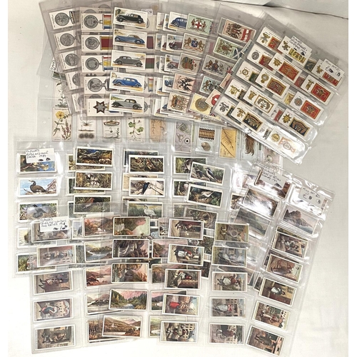 125 - A selection of cigarette cards:  Struggle for existence Player's set 25; hidden beauties 25; bi... 