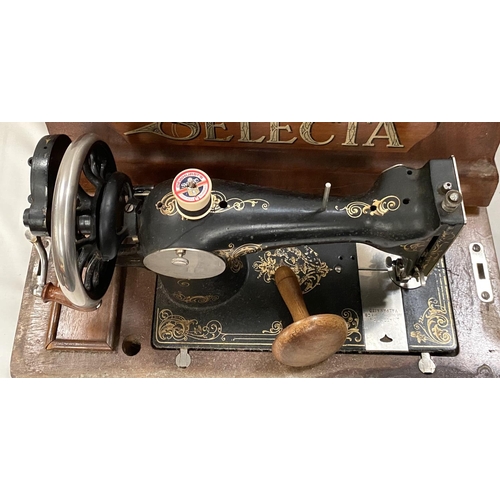 148 - A hand operated sewing machine in inlaid caseNo bids sold with next lot