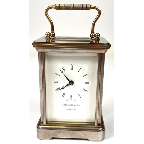 165 - A modern brass carriage clock by Garrard & Co. London.