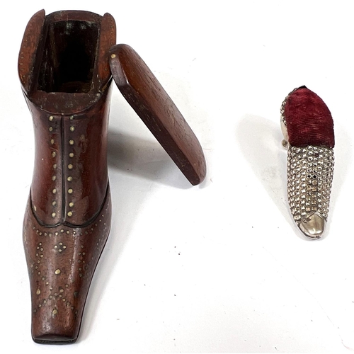 166 - A 19th century novelty snuff box in the form of a boot; a novelty silver pin cushion in the form of ... 