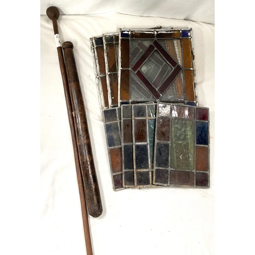 170 - A wooden truncheon; stained glass panels etc.