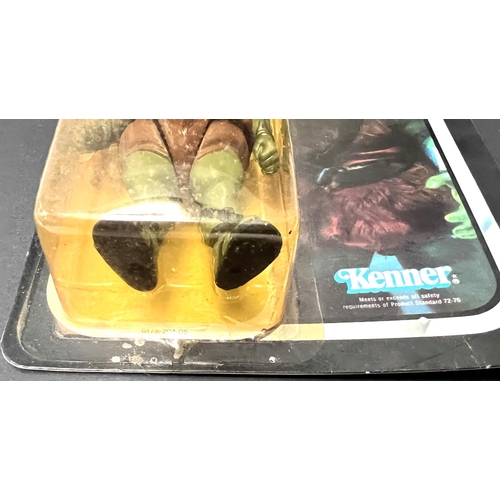 253 - A Kenner Return of the Jedi figure:  Gamorrean Guard, on card in (yellowed) blister pack, 3.75