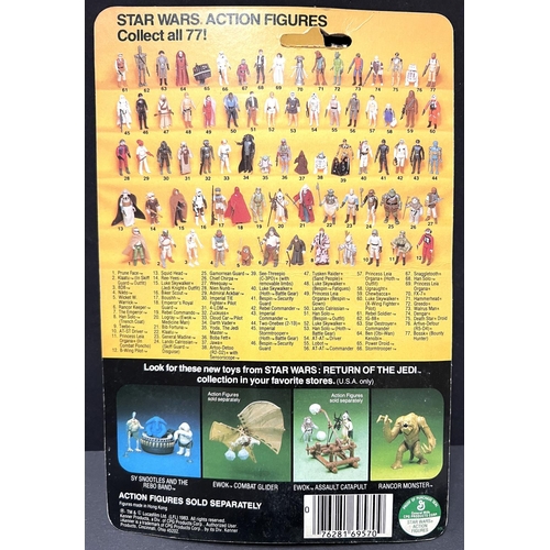 253 - A Kenner Return of the Jedi figure:  Gamorrean Guard, on card in (yellowed) blister pack, 3.75