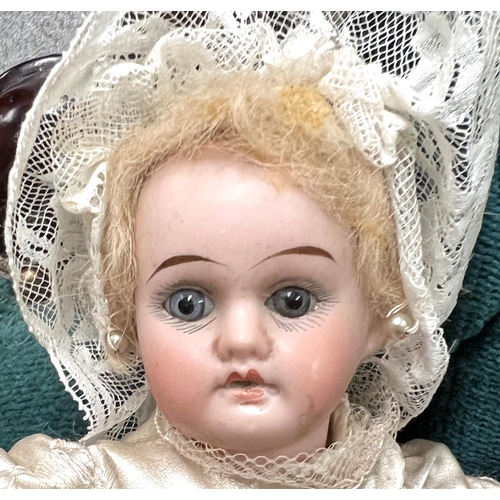 Two late 19th/early 20th century small bisque head girl dolls with