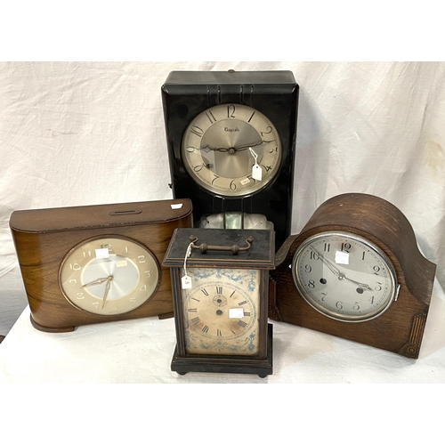 31 - A 1950's 'Savings' mantel clock in walnut case with coin slot; a 1930's mantel clock with strike in ... 