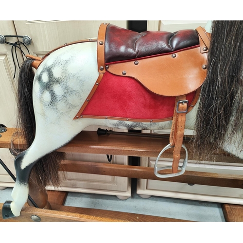 314 - ROCKING HORSE: A Stephenson Brothers England large dappled grey swing action Rocking Horse, 2008, no... 