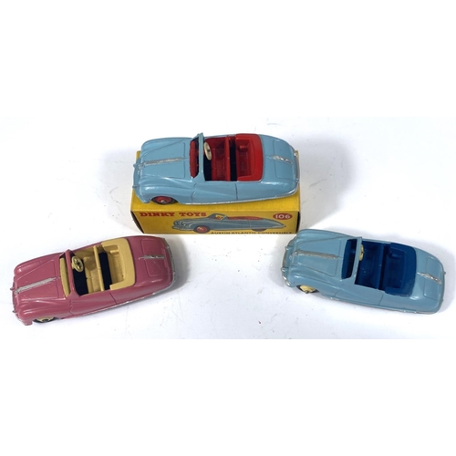 358 - DINKY TOYS: Three 106 Austin Atlantic Convertibles, pink with beige interior and hubcaps, two blue o... 