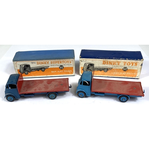 393 - DINKY TOYS: Two 512 one Supertoys Guy Flat Truck, one dark blue with red flat bed one light blue wit... 