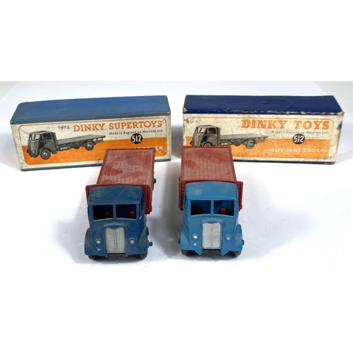 393 - DINKY TOYS: Two 512 one Supertoys Guy Flat Truck, one dark blue with red flat bed one light blue wit... 