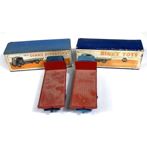 393 - DINKY TOYS: Two 512 one Supertoys Guy Flat Truck, one dark blue with red flat bed one light blue wit... 