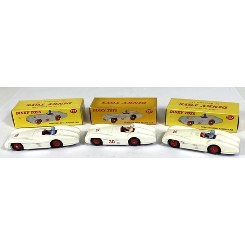 408 - DINKY TOYS: Three 237 Mercedes Benz Racing Cars, white body work two blue and one white driver, all ... 