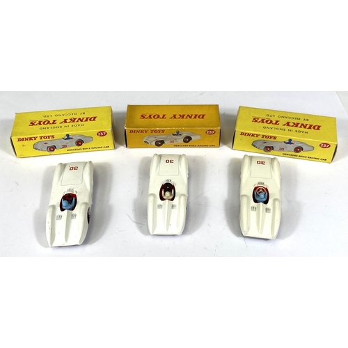 408 - DINKY TOYS: Three 237 Mercedes Benz Racing Cars, white body work two blue and one white driver, all ... 