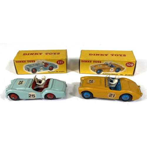 410 - DINKY TOYS: 109 Austin-Healey '100' Sports yellow body with blue interior and hubcaps in original bo... 