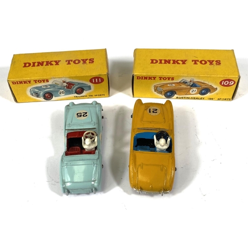 410 - DINKY TOYS: 109 Austin-Healey '100' Sports yellow body with blue interior and hubcaps in original bo... 