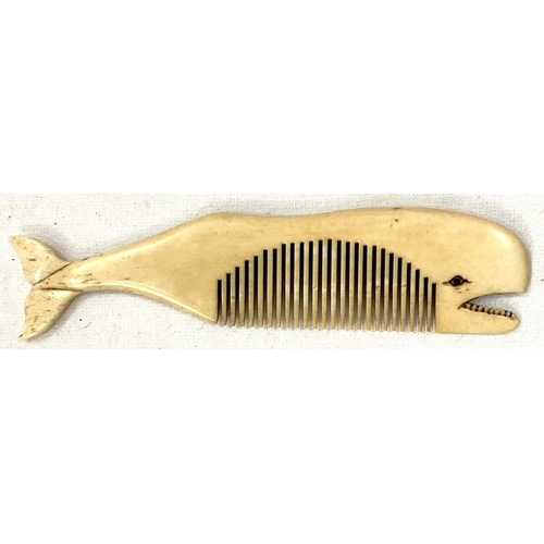 42 - A scrimshaw whalebone comb carved in the form of a whale, length 11cm