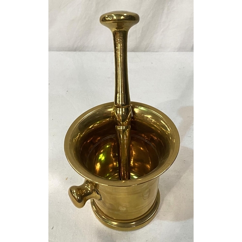 43 - A 19th century large brass pestle and mortar