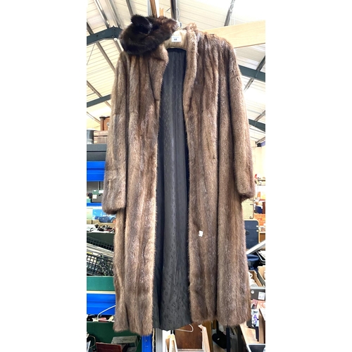 44 - A full length medium brown mink coat; a mink hat