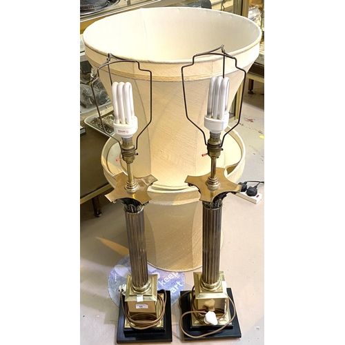 45 - A pair of large brass table lamps with Corinthian columns, with shades