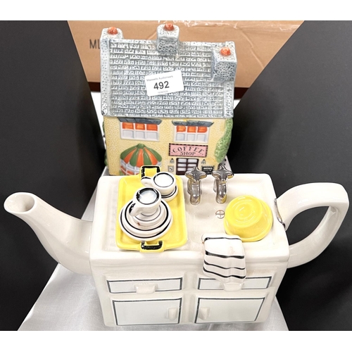 492 - A selection of various novelty teapots in the form of kitchen items and cottages