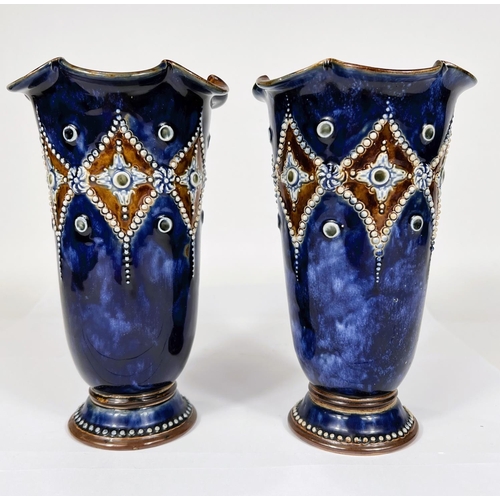 508 - A pair of Royal Doulton tapering pedestal vases with scalloped rims in blue/brown glaze with beaded ... 