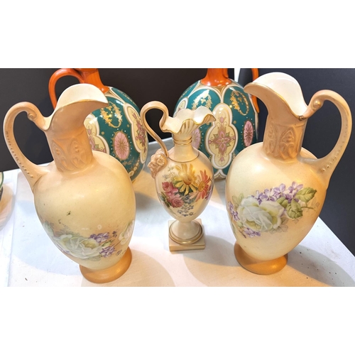 510 - A Royal Worcester classical ewer hand painted with flowers on a peach blush ground, ht. 16.5cm; a pa... 