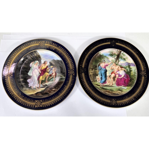 513 - A pair of Vienna Polychrome plates with classical figures in landscapes, blue and gilt borders, diam... 