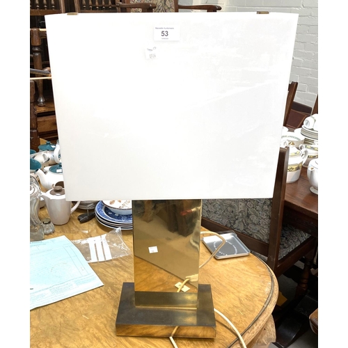 53 - A gilt metal rectangular table lamp with 2 bulbs in white shade; a table lamp in white china/stone e... 