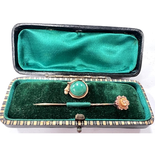 662 - A Victorian diamond set stick pin; a yellow metal stud set with a green stone.